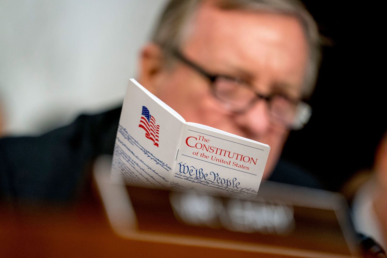 Sen. Dick Durbin, a Democrat from Illinois, holds up a copy of the Constitution as he speaks during Tuesday's hearing.