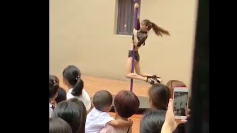 A pole dancing display put on in front of children and parents at a Chinese kindergarten in Shenzhen on Monday, September 3.