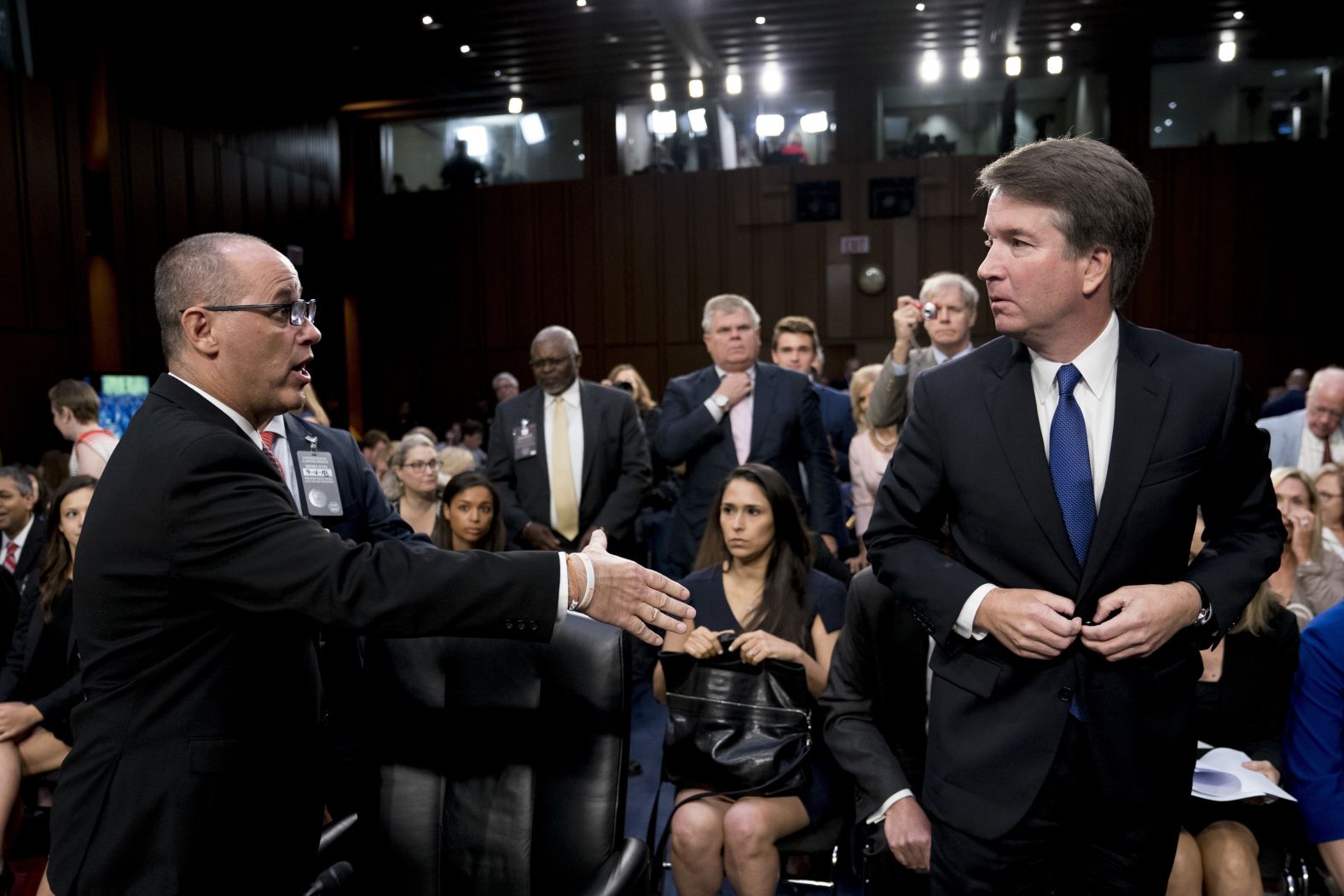 Fred Guttenberg <a href="index.php?page=&url=https%3A%2F%2Fwww.cnn.com%2Fpolitics%2Flive-news%2Fkavanaugh-hearing-dle%2Fh_6e03e5036ea269b3a602ab04b4afc2a5" target="_blank">attempts to shake hands with Kavanaugh</a> as Kavanaugh leaves for a lunch break. Guttenberg is the father of Jaime Guttenberg, who was killed in the Marjory Stoneman Douglas High School shooting in Parkland, Florida, earlier this year. <a href="index.php?page=&url=https%3A%2F%2Ftwitter.com%2Ffred_guttenberg%2Fstatus%2F1037023269923287041" target="_blank" target="_blank">Guttenberg said on Twitter</a> that Kavanaugh "pulled his hand back, turned his back to me and walked away." A source familiar with the encounter said that Kavanaugh did not know who Guttenberg was and security intervened to end the exchange before there could be a handshake. White House spokesman Raj Shah <a href="index.php?page=&url=https%3A%2F%2Ftwitter.com%2FRajShah45%2Fstatus%2F1037040825778274306" target="_blank" target="_blank">also tweeted</a> that security intervened before Kavanaugh could shake Guttenberg's hand.