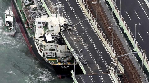 A tanker rests after slamming into the side of an Osaka bridge that connects the airport to the mainland, damaging part of the bridge and the vessel.