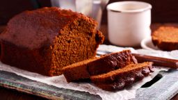Dark ginger loaf bread, sliced on table; Shutterstock ID 762622300; Job: -