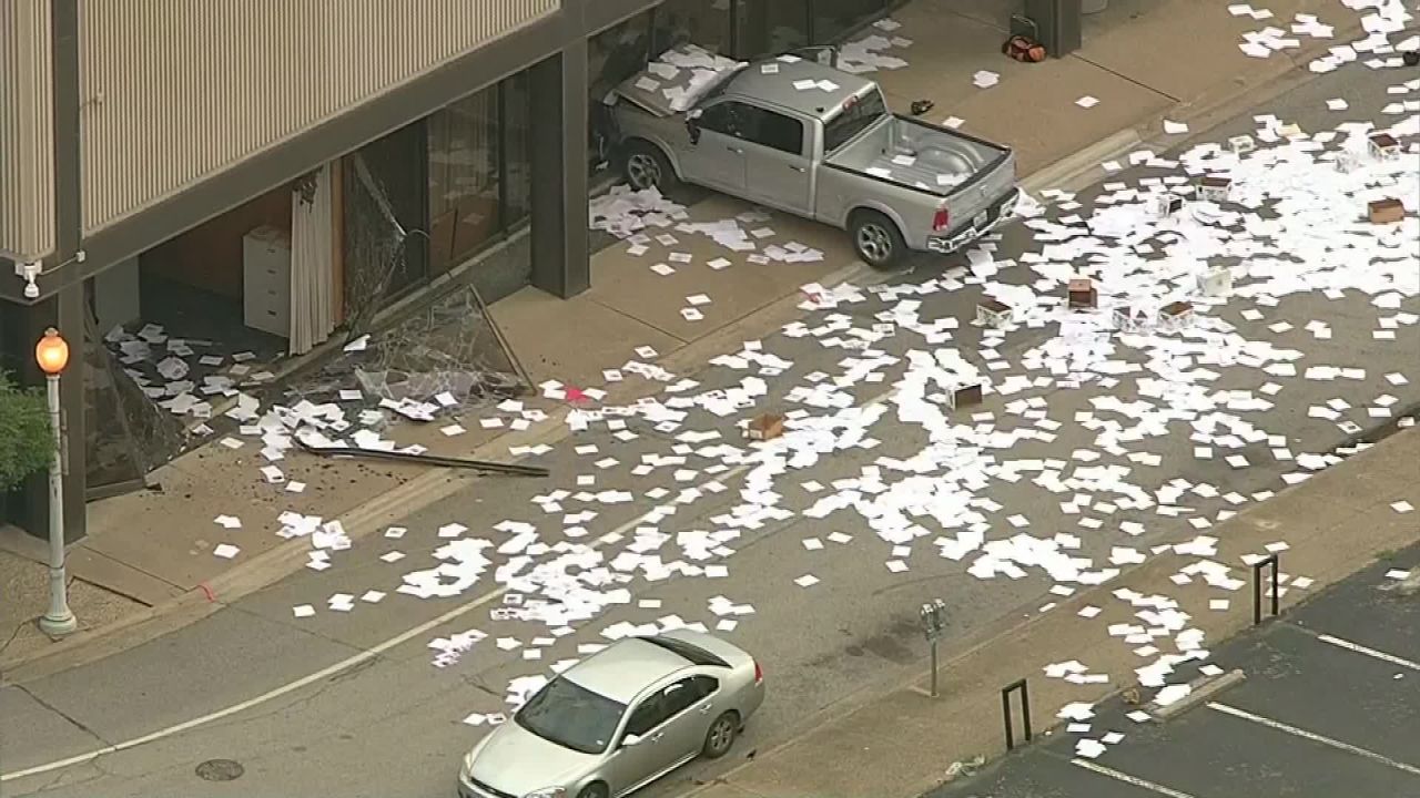 Footage shows papers strewn across the ground Wednesday after the truck smashed into the station.