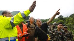 Two British cave-divers (2nd and 3rd-L) with Thai army soldiers and local rescue personnel are seen searching for new openings in the mountain of Khun Nam Nang Non Forest Park in Chiang Rai province on June 28, 2018 during rescue operation for a missing children's football team and their coach in Tham Luang cave. - A team of US military personnel and British divers joined rescue efforts at a flooded cave in northern Thailand where 12 children and their football coach have been trapped for five days as heavy overnight rains hampered the search. (Photo by Krit PHROMSAKLA NA SAKOLNAKORN / THAI NEWS PIX / AFP)        (Photo credit should read KRIT PHROMSAKLA NA SAKOLNAKORN/AFP/Getty Images)