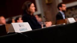 The seat for Alphabet (Google) CEO Larry Page sits empty as Twitter CEO Jack Dorsey (R) and Facebook COO Sheryl Sandberg (C) testify before the Senate Intelligence Committee on Capitol Hill in Washington, DC, on September 5, 2018. (Photo by Jim WATSON / AFP)        (Photo credit should read JIM WATSON/AFP/Getty Images)