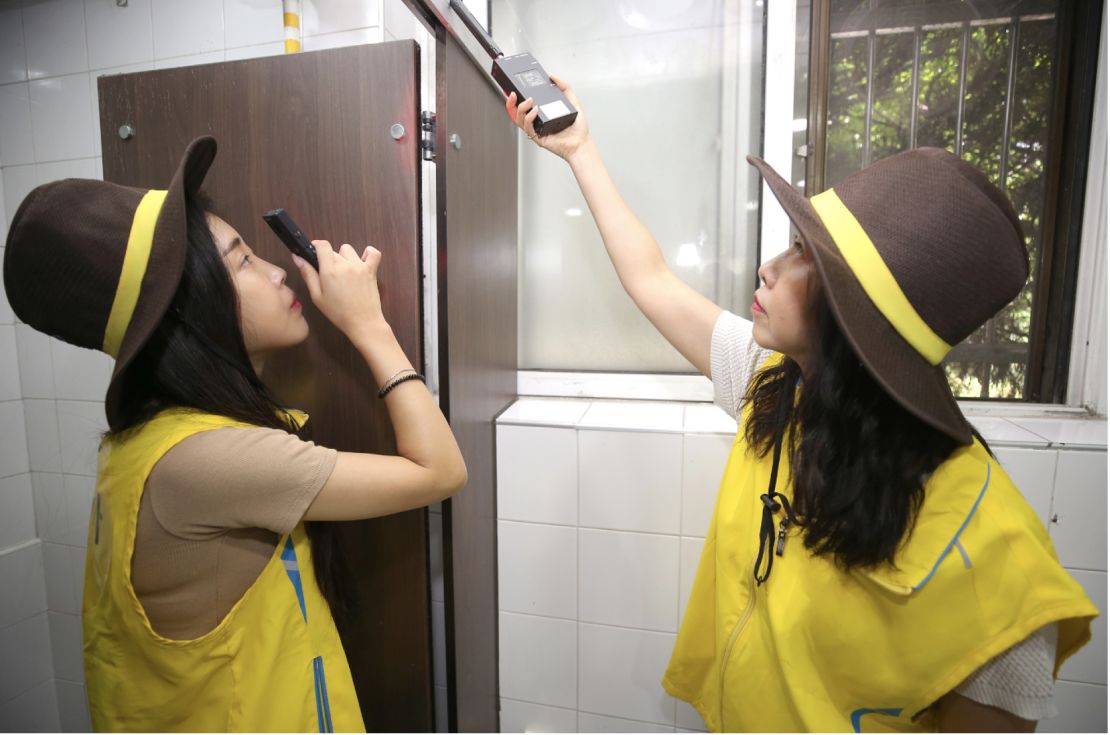 Women's safety sheriffs inspect a toilet in Seocho, a district of Seoul. The South Korean capital recently announced plans to conduct daily patrols of restrooms for hidden cameras. 