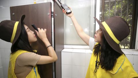 Women's safety sheriffs inspect a toilet in Seocho, a district of Seoul. The South Korean capital recently announced plans to conduct daily patrols of restrooms for hidden cameras. 