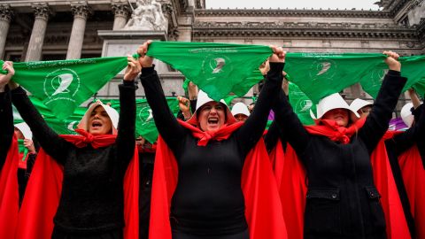 Activists in favor of the legalization of abortion disguised as characters from "The Handmaid's Tale" display green headscarves as they perform outside the National Congress in Buenos Aires, Argentina, on July 25, 2018.