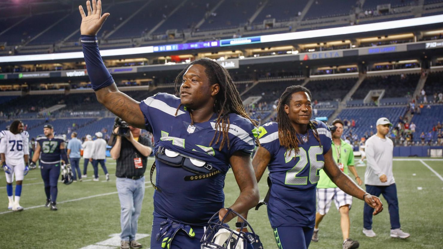 Shaquem Griffin, left, and his twin, Shaquill Griffin, walk off the field after a preseason game on August 9.