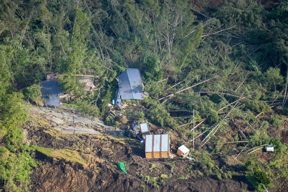 This picture shows an aerial view of houses damaged by a landslide in Atsuma, Hokkaido, on September 6, 2018, after an earthquake hit the northern Japanese island of Hokkaido.