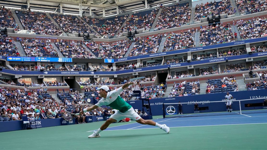 Nishikori stretches for a return during his quarterfinal match against Marin Cilic.