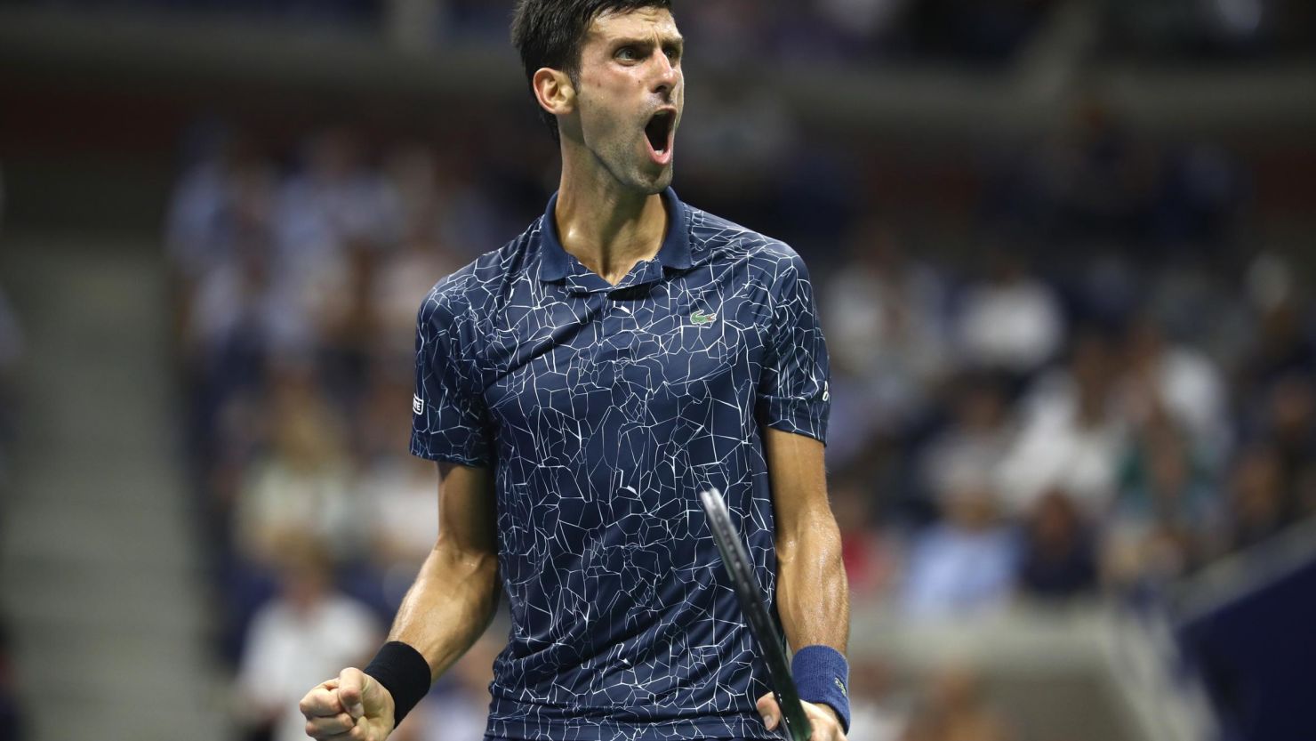 Novak Djokovic of Serbia celebrates a point during his men's singles quarter-final match against John Millman of Australia at the 2018 US Open.