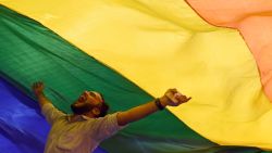 A member of the lesbian, gay, bisexual, transgender (LGBT) community celebrates the Supreme Court decision to strike down a colonial-era ban on gay sex, in Mumbai on September 6, 2018. - India's Supreme Court on September 6 struck down the ban that has been at the centre of years of legal battles. "The law had become a weapon for harassment for the LGBT community," Chief Justice Dipak Misra said as he announced the landmark verdict. (Photo by INDRANIL MUKHERJEE / AFP)        (Photo credit should read INDRANIL MUKHERJEE/AFP/Getty Images)