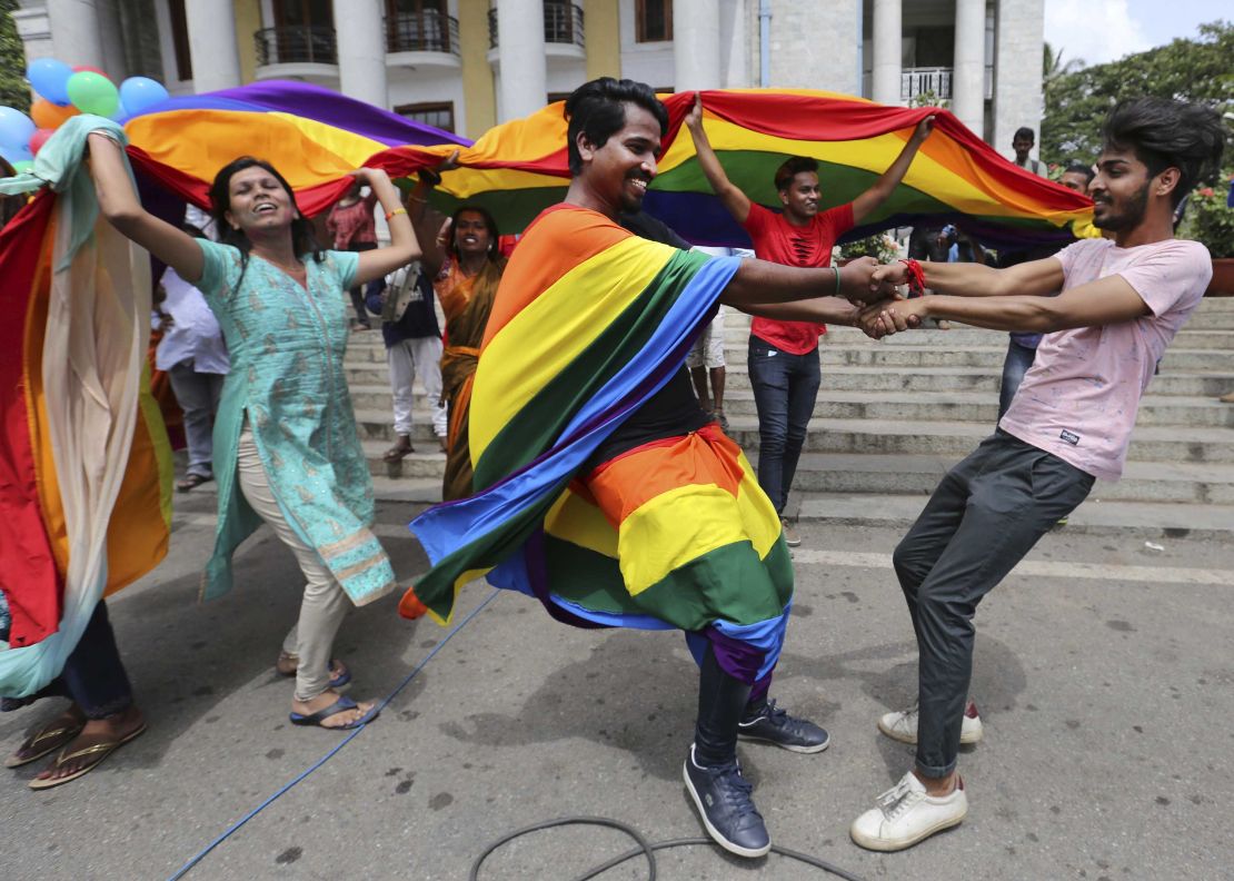 Members of India's LGBT community dance in celebration after the ruling was announced in Bangalore on Thursday.