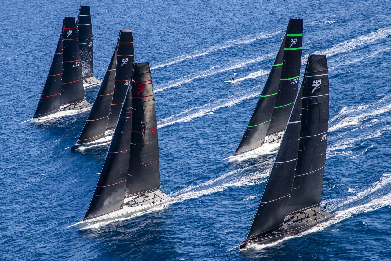 The Maxi 72 class holds its world championship during the week, with crews of big-name sailors and affluent owners helming their stripped-out rocketships in perfect conditions.   