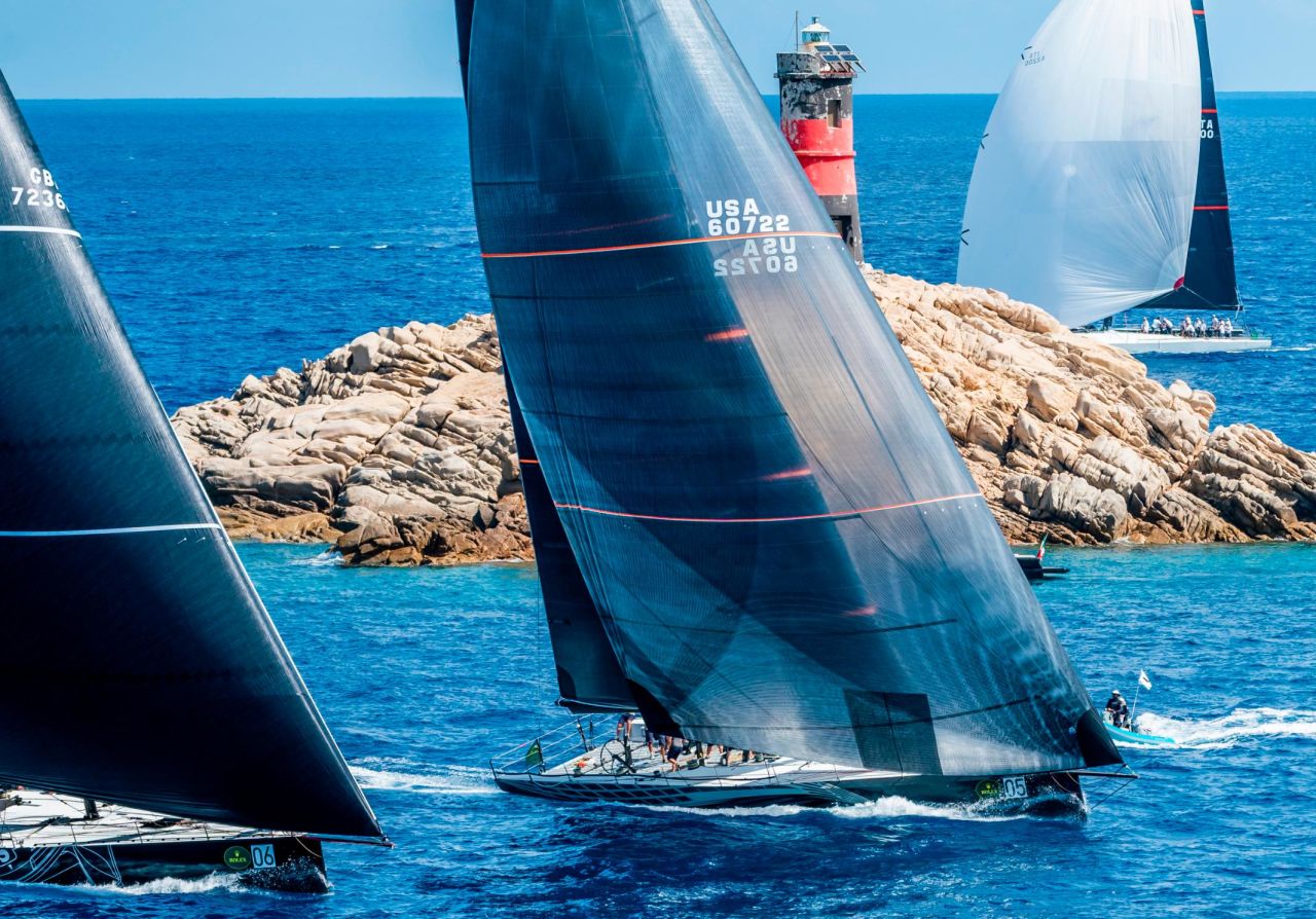 American yacht Proteus, owned by Greek magnate George Sakellaris, leads her Maxi 72 rivals through a tight passage in the Maddalena islands. 