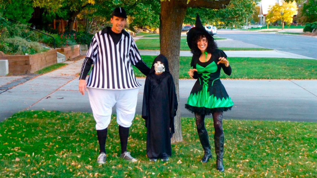 They now have a 10-year-old son, pictured here with his parents at Halloween.