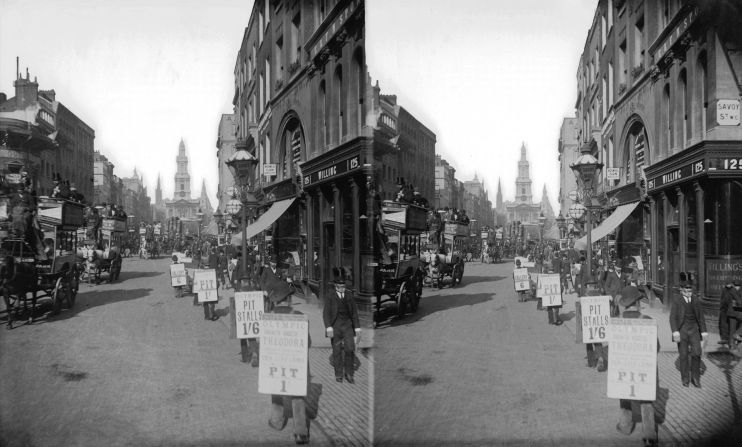 Sandwichboard men in the Strand advertise theater seats, 1894. 