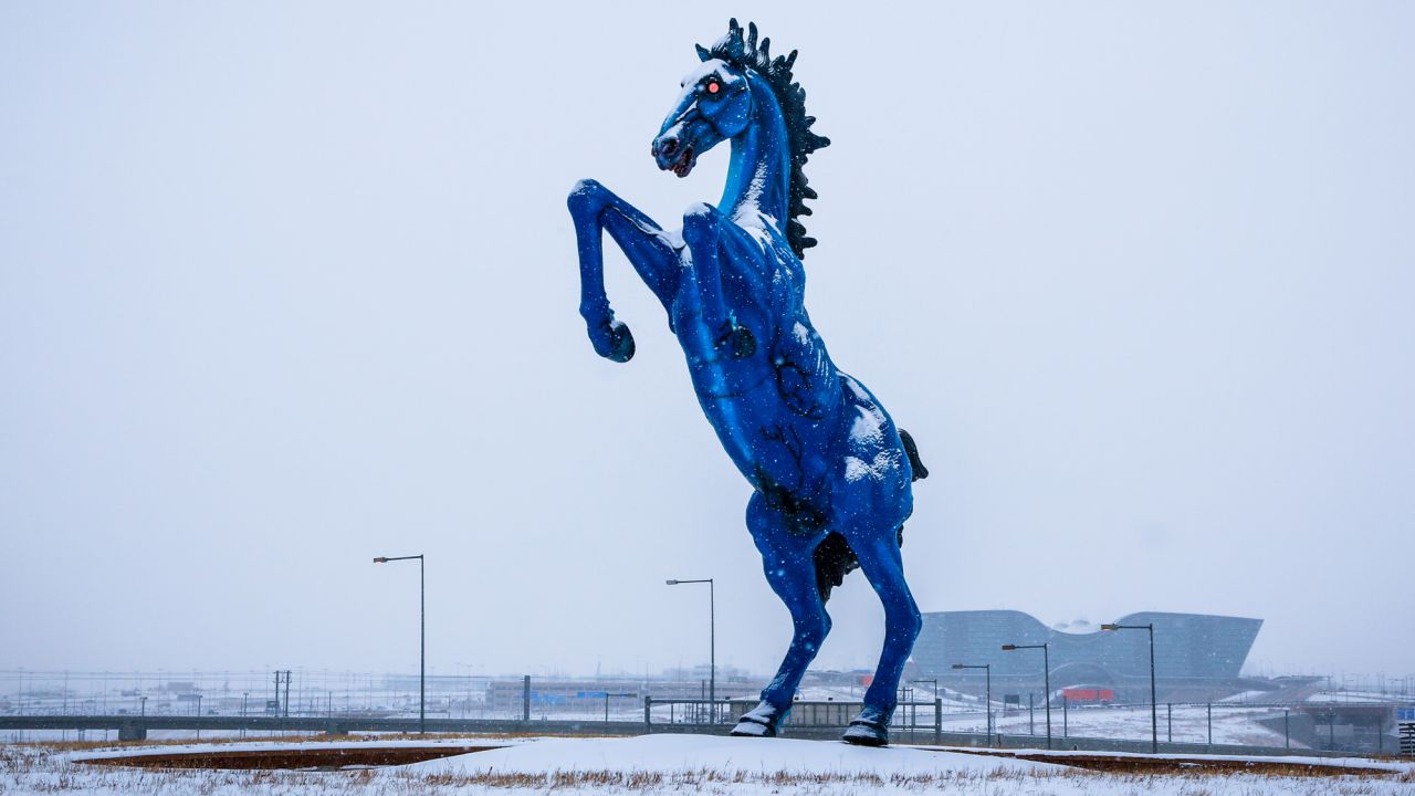 The 32-foot-tall "Mustang" statue rears up by the road leading to Denver International Airport