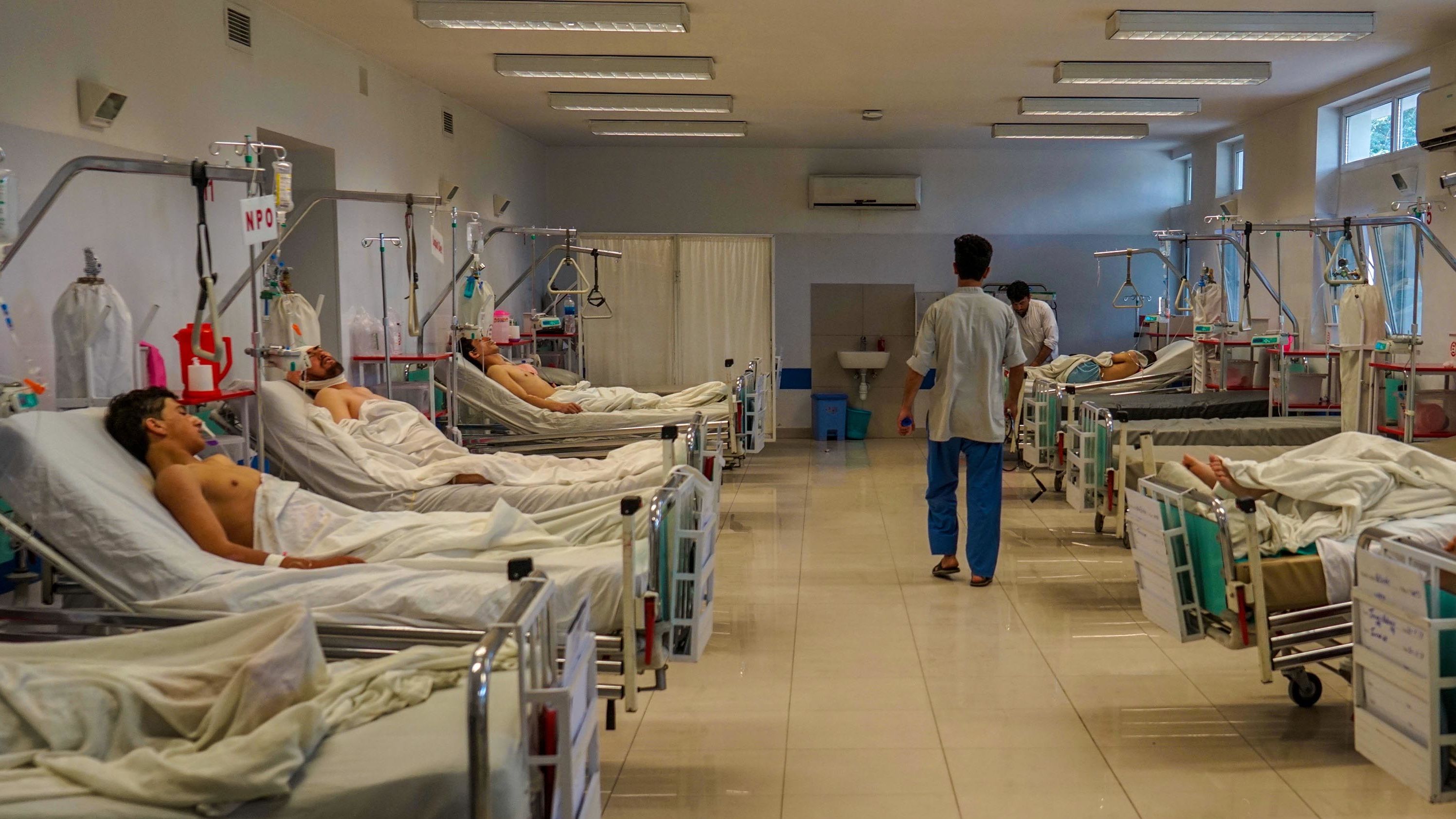 A nurse walks down a recovery ward in Emergency's Surgical Center in Kabul. 2018 has been the hospital's busiest year on record.
