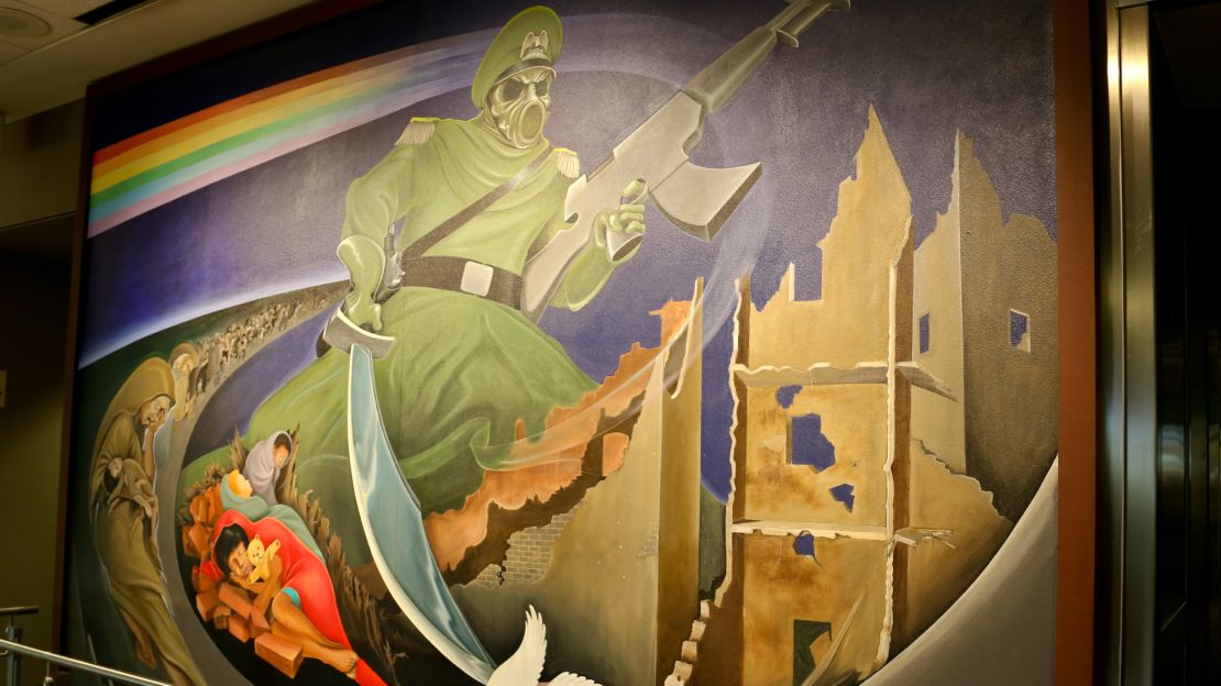 The mural "Children of the World Dream of Peace" features some violent imagery, but celebrates peace triumphing over war. 