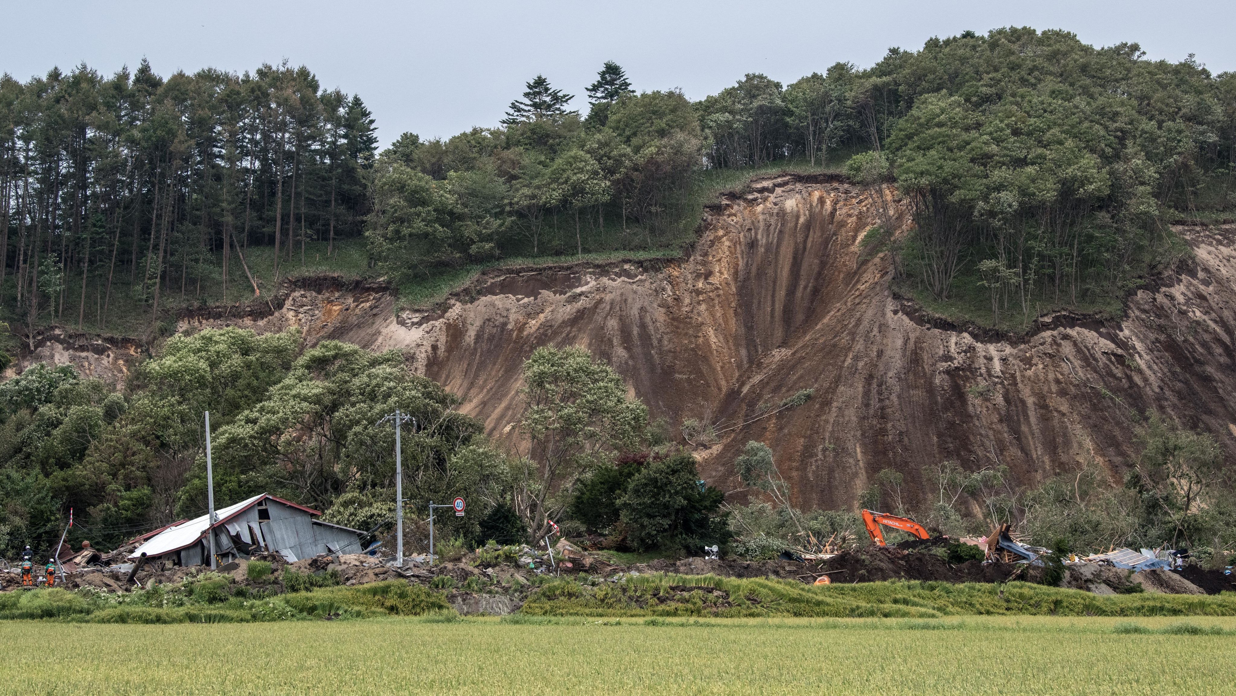 Buildings lie in ruins after being hit by a landslide caused by an earthquake, on September 7, 2018 in Atsuma.