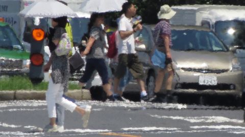 The effects of heat haze is seen during a heatwave in Tokyo on August 2, 2018.