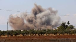 Smoke billows following Saturday's bombardment around the village of al-Muntar in the rebel-held Idlib province.