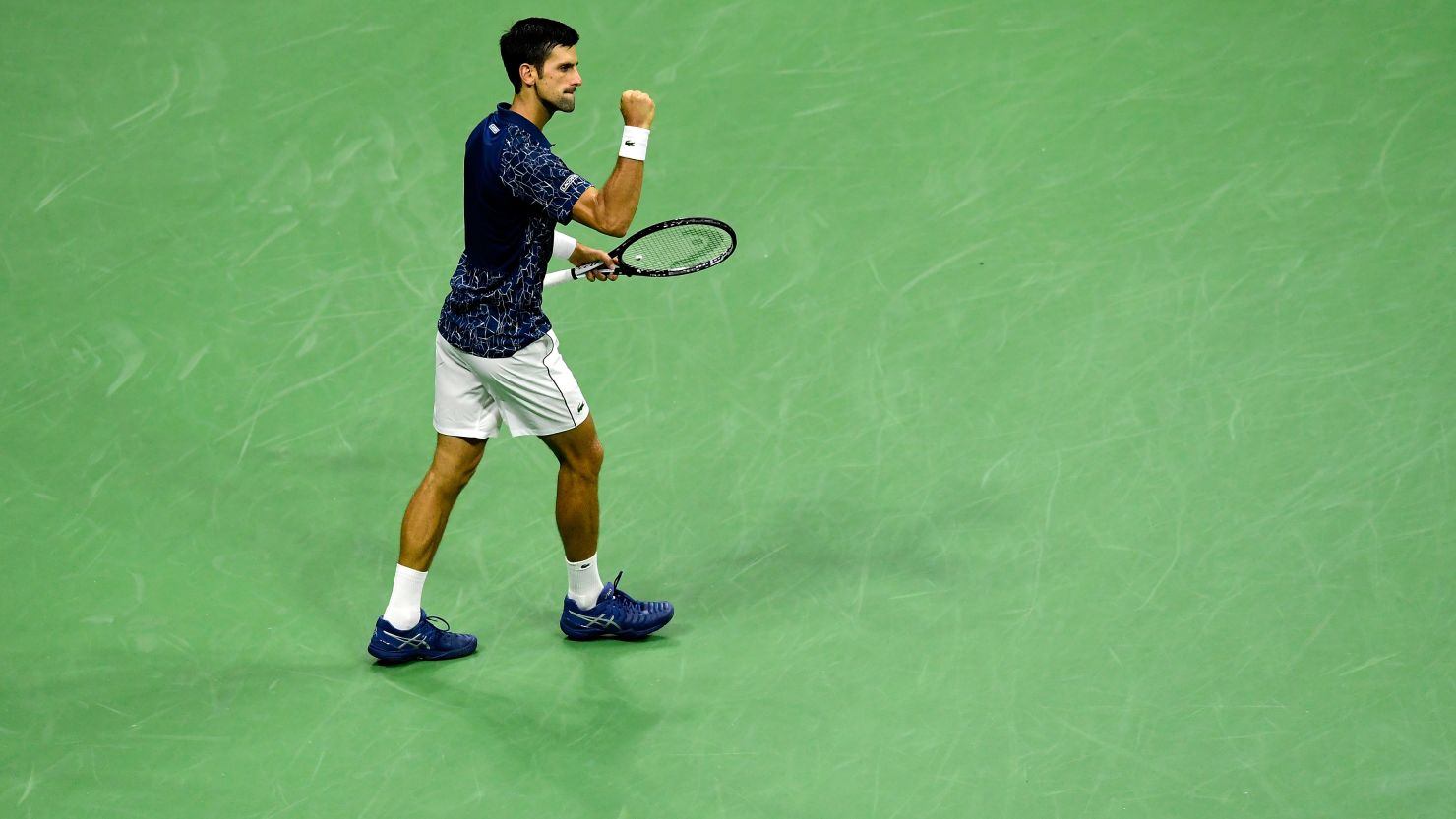 Novak Djokovic of Serbia celebrates victory following his men's singles semifinal match against Japan's Kei Nishikori.