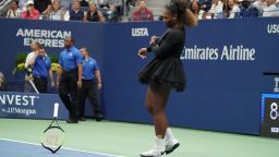 Serena Williams of the US smashes her racquet while playing against Naomi Osaka of Japan during their Women's Singles Finals match at the 2018 US Open at the USTA Billie Jean King National Tennis Center in New York on September 8, 2018. 