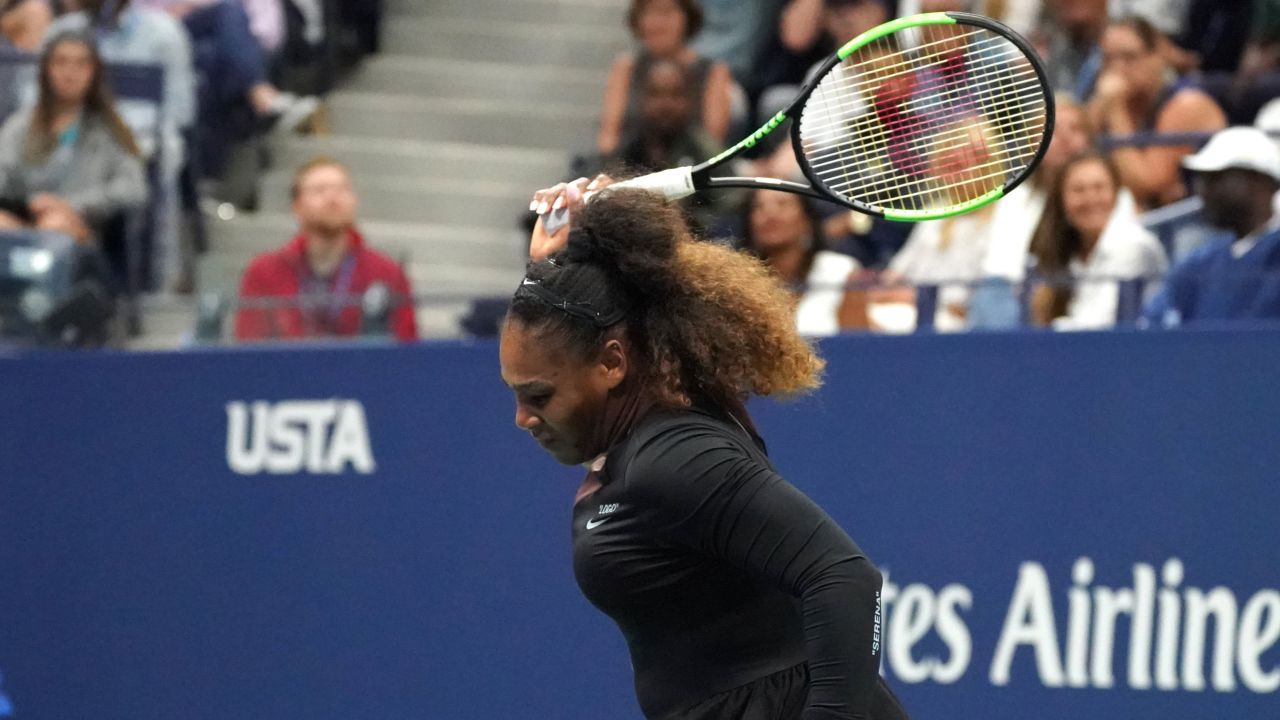 Serena Williams of the US smashes her racquet while playing against Naomi Osaka of Japan during their Women's Singles Finals match at the 2018 US Open. 