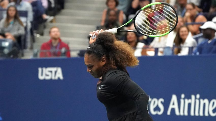 Serena Williams of the US smashes her racquet while playing against Naomi Osaka of Japan during their Women's Singles Finals match at the 2018 US Open at the USTA Billie Jean King National Tennis Center in New York on September 8, 2018.