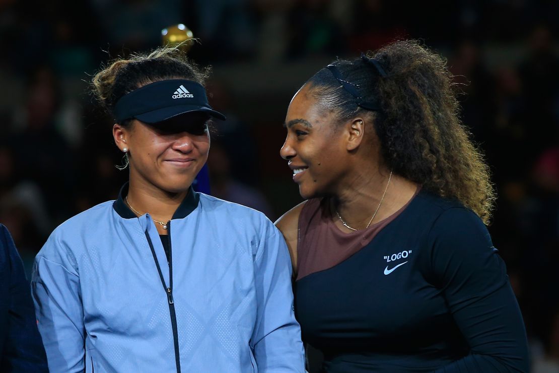 The two finalists share a laugh during the trophy ceremony. 