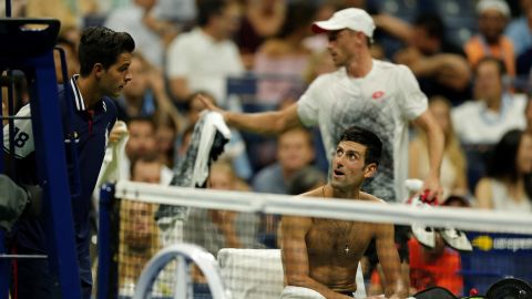 Novak Djokovic stayed in court while John Millman of Australia left the pitch to change his shirt due to the humidity during a US Open Men's singles quarter-finals match on Wednesday.
