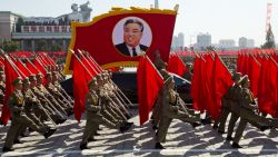 North Korean soldiers march with a float showing late North Korean leader Kim Il Sung during a parade for the 70th anniversary of North Korea's founding day in Pyongyang, North Korea, Sunday, September 9, 2018. North Korea staged a major military parade, huge rallies and will revive its iconic mass games on Sunday to mark its 70th anniversary as a nation.