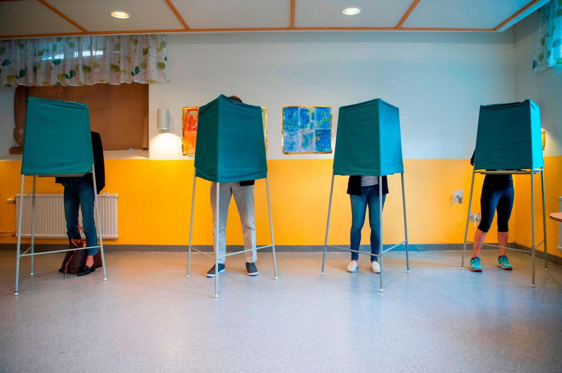 Voters marking their choices a polling station in Stockholm on Sunday. 