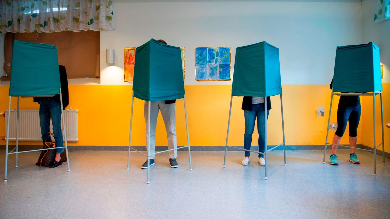 Voters mark their choices at a polling station in Stockholm on Sunday.