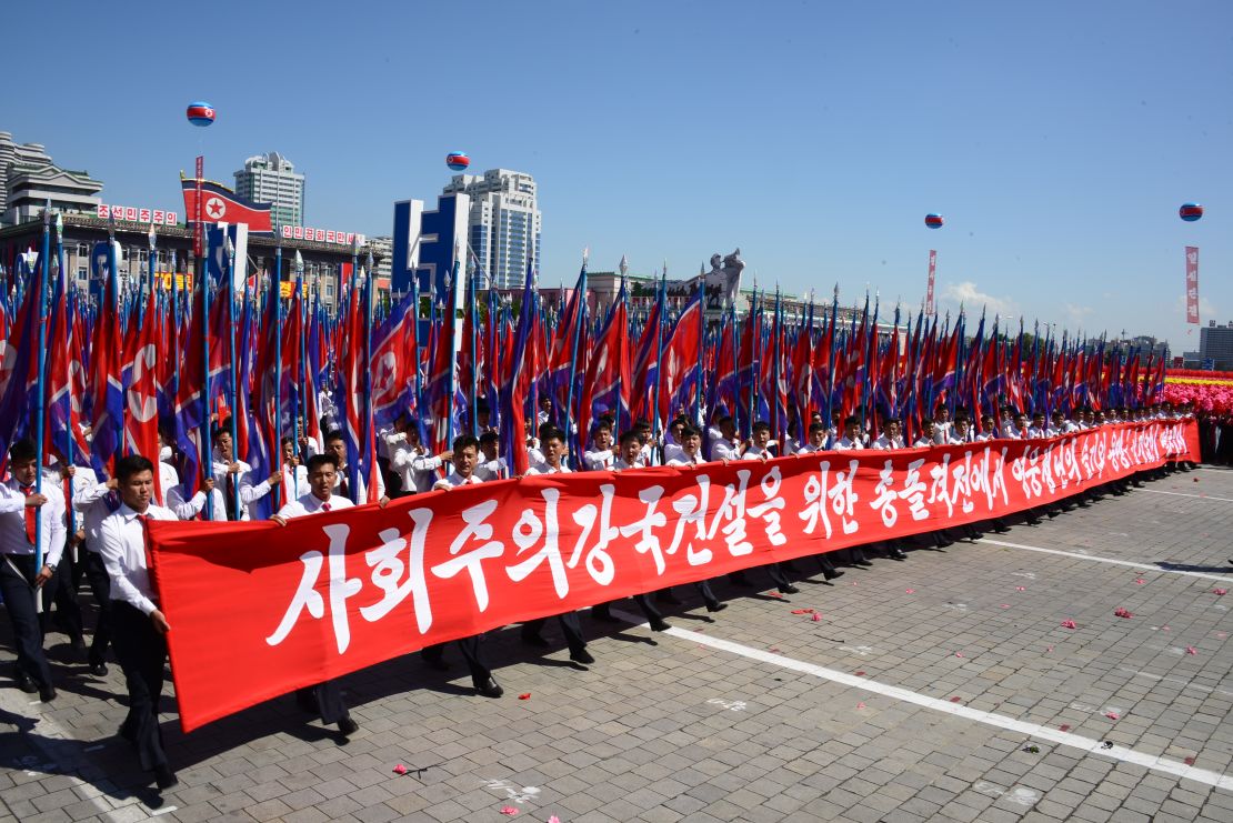 North Koreans march in Kim Il Sung Square as part of Sunday's civilian parade.