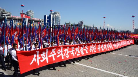 North Koreans march in Kim Il Sung Square as part of Sunday's civilian parade.