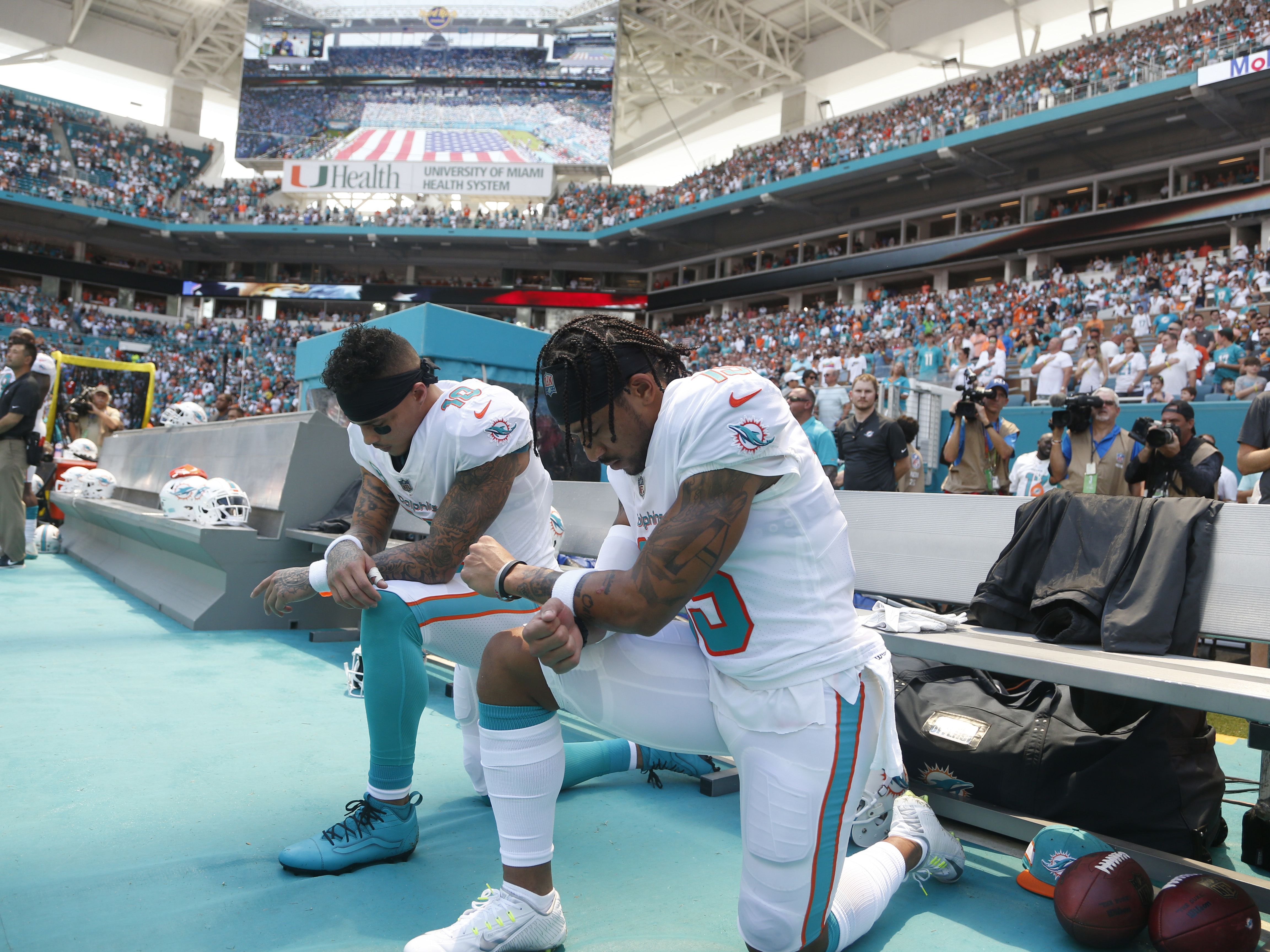 Two Miami Dolphins kneel for National Anthem