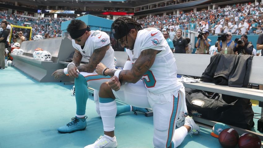Miami Dolphins wide receiver Kenny Stills (10) and Miami Dolphins wide receiver Albert Wilson (15) kneel during the national anthem before an NFL football game against the Tennessee Titans, Sunday, Sept. 9, 2018, in Miami Gardens, Fla. (AP Photo/Wilfredo Lee)