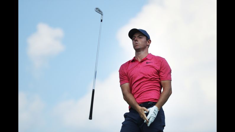 Rory McIlroy tosses his club after playing his shot from the eighth tee during the first round of the BMW Championship at Aronimink Golf Club on Thursday, September 6, in Newtown Square, Pennsylvania.  