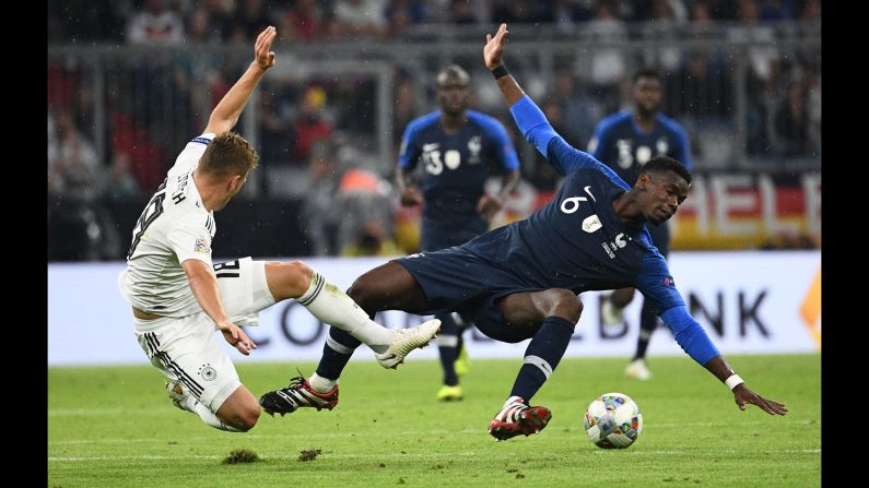 France midfielder Paul Pogba vies with Germany midfielder Joshua Kimmich during the UEFA Nations League football match on Thursday, September 6, at the Allianz Arena in Munich, Germany.