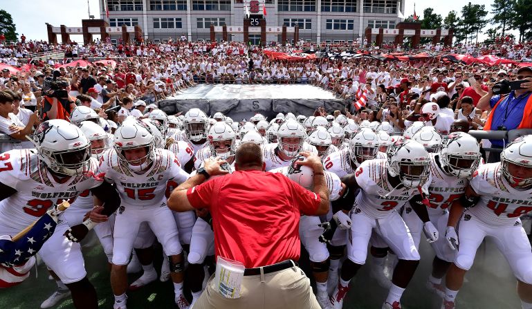 North Carolina State head coach Dave Doeren with his team before they take the field against the Georgia State Panthers at Carter-Finley Stadium on Saturday, September 8, in Raleigh, North Carolina. 