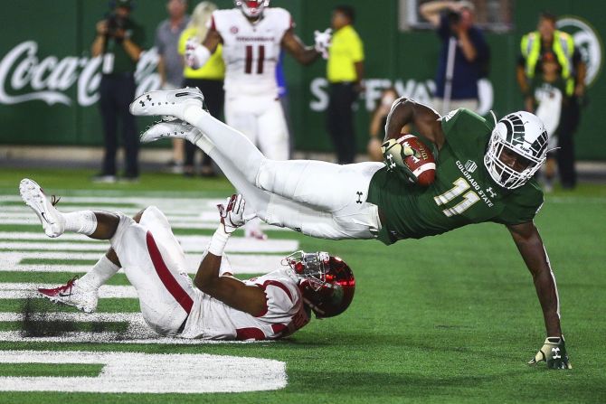 Colorado State Rams' Preston Williams hauls in a touchdown catch over Arkansas' Jarques McClellion. The Rams rallied from a 27-9 deficit to post a 34-27 win over the Razorbacks in Fort Collins on Saturday, September 8.