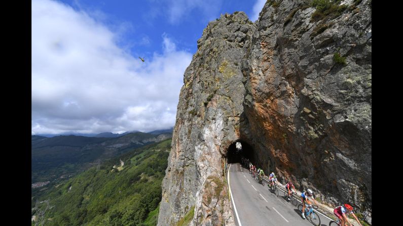 The peloton exits a mountain tunnel during the 73rd Tour of Spain on Friday, September 7, in La Camperona, Spain. 