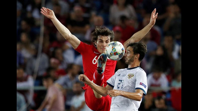 Turkey's Caglar Soyuncu in action with Russia's Aleksandr Erokhin during a UEFA Nations League match on Friday, September 7.