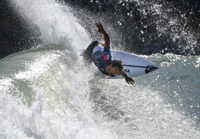 Jeremy Flores surfs off the lip during the qualifying round of the WSL Surf Ranch Pro at the Kelly Slater Surf Ranch in Lemoore, California, on Saturday, September 8. The four-day event brings the world's top surfers to compete on perfect machine-created waves in a half-mile long wave pool situated 100 miles inland from the Pacific Ocean.