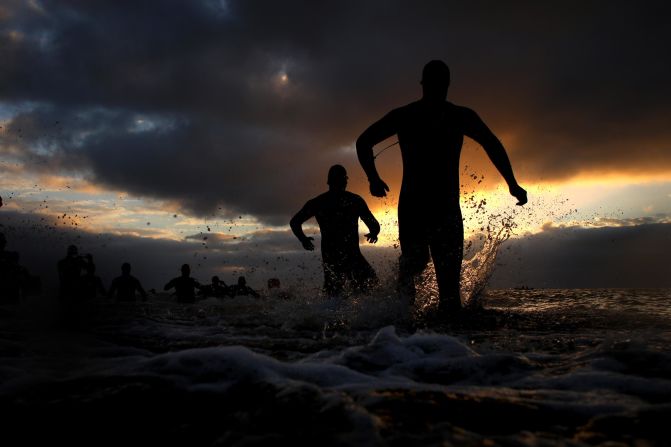 Participants compete in the swim leg of the race during Ironman Wales on Saturday, September 8, in Tenby, Wales.