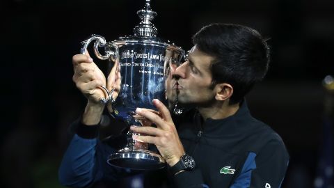 Novak Djokovic hoists the US Open trophy after beating Juan Martin del Potro. 