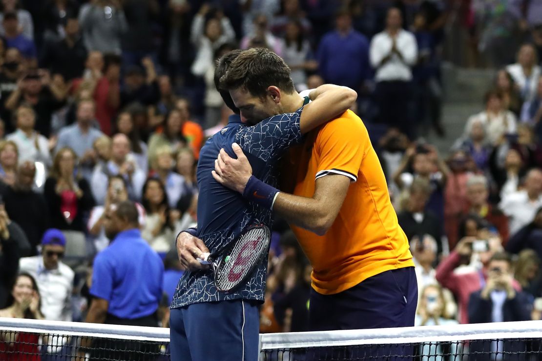 Novak Djokovic and Juan Martin del Potro exchange a hug. 